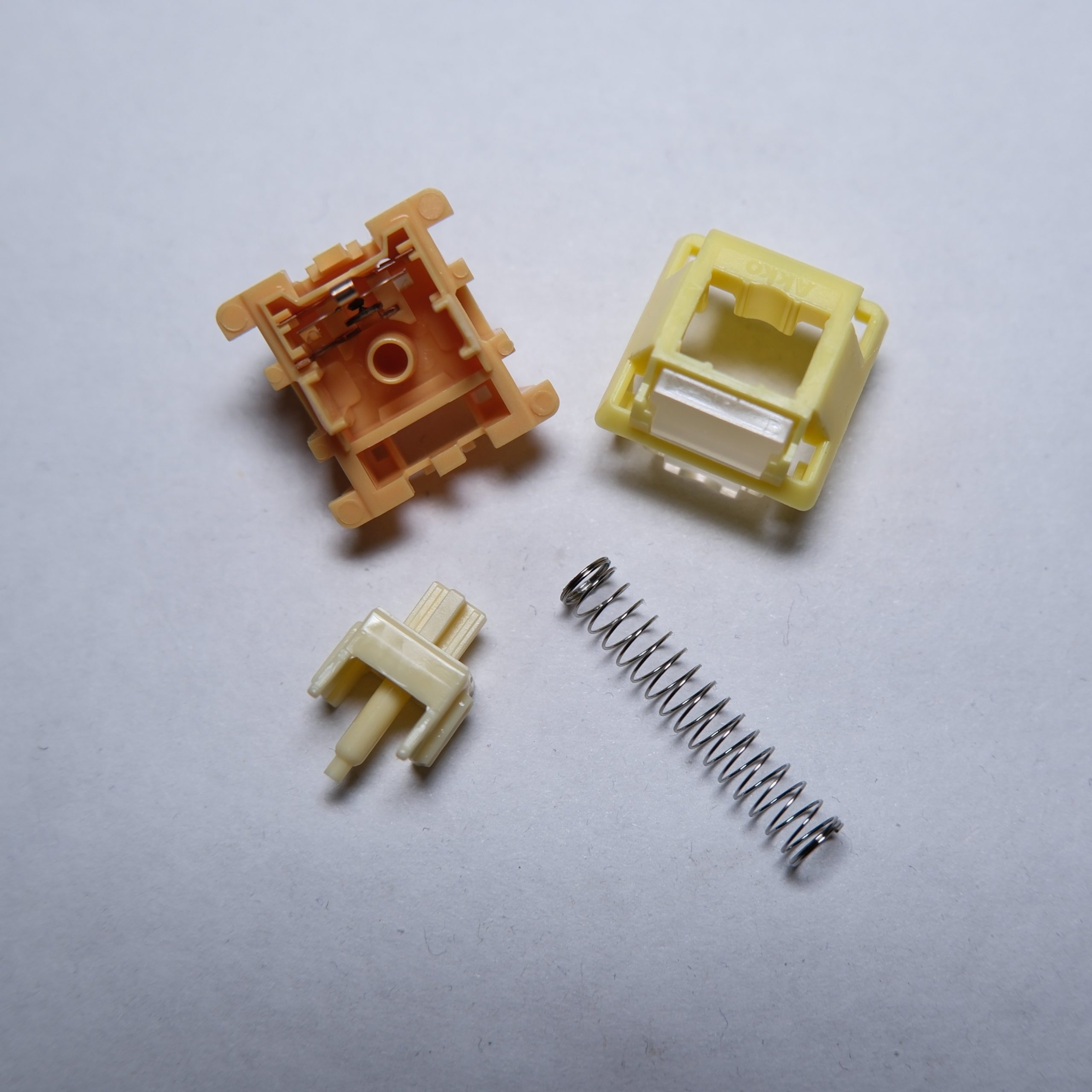 Akko Creamy Yellow U1 switch disassembled.